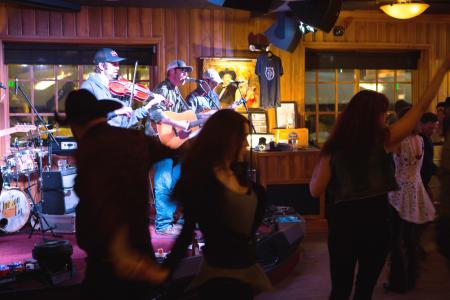 people dance while a band performs at Silver Dollar Bar in Jackson Hole