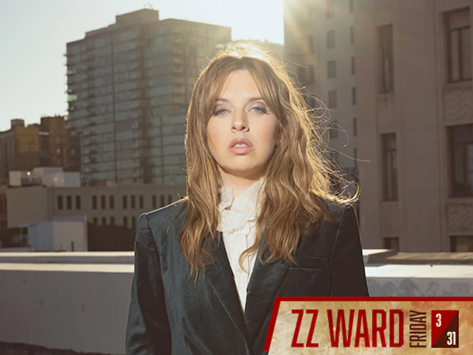 ZZ Ward, a Rendezvous artist, standing on a city rooftop