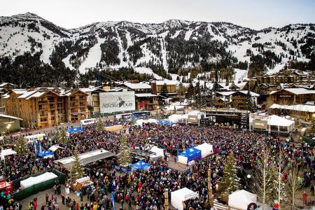 Crowds of people cover the area of the Jackson Hole Mountain Resort during a live show.