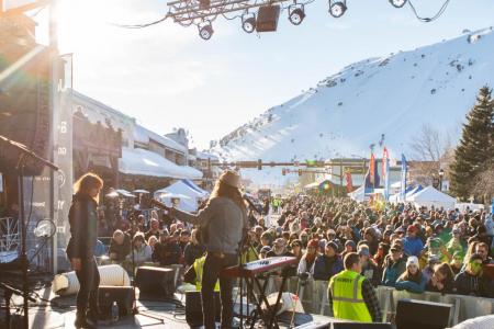 A band performing in front of an audience during the Jackson Hole Rendezvous Spring Festival.